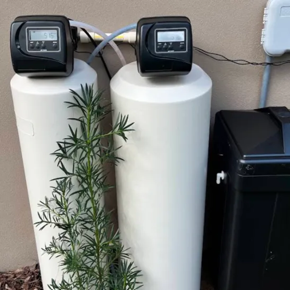 Affordable Water Solutions water softener featuring digital Clack control valves and twin white tanks