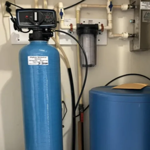 Professional multi-tank point-of-entry water treatment system configured to balance pH levels and eliminate hard water minerals simultaneously, expertly installed by Alleghany Mechanical Services
