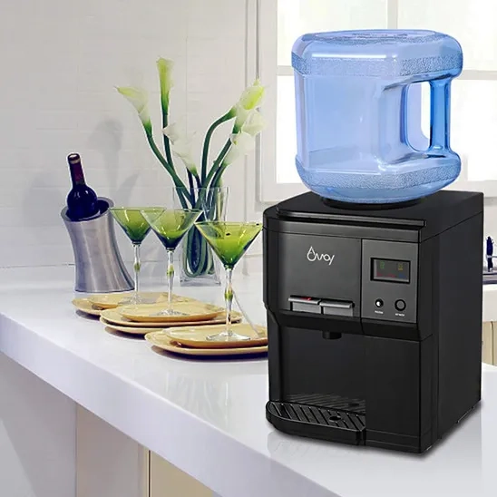  Amay Hot and Cold Countertop Water Cooler Dispenser is on the countertop.