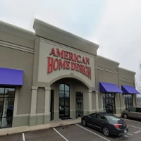 Close-up view of the American Home Design sign above the main arched entrance.