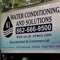 A1 Water Conditioning truck showing its services: water softeners, salt deliveries, and water filters.
