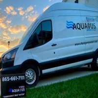 Veteran-owned Aqua US van for water systems, showing logo, phone, and changemywater.com website.