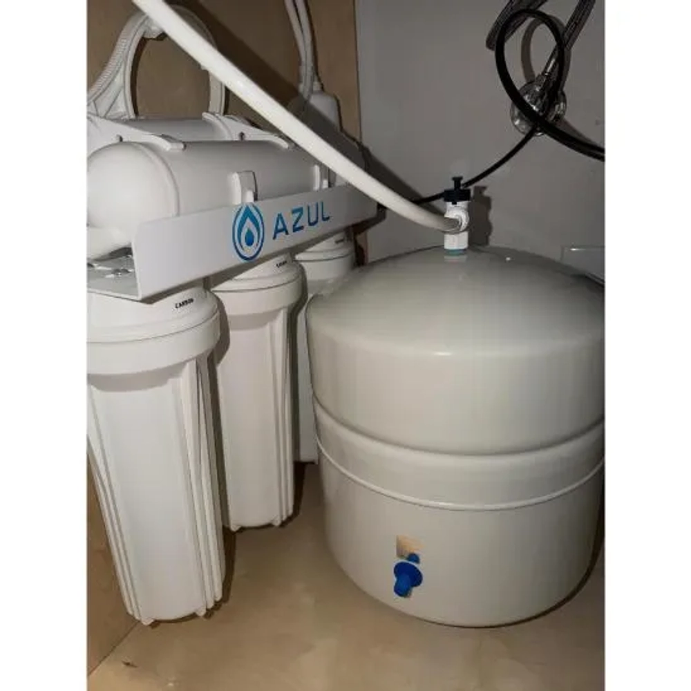 Under-counter Azul reverse osmosis system featuring sediment filters and a white water storage tank.