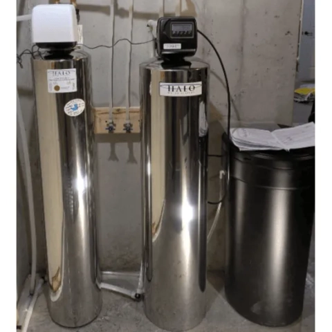 Blue Duck Plumbing high-efficiency water softener and brine tank assembly installed for residential use