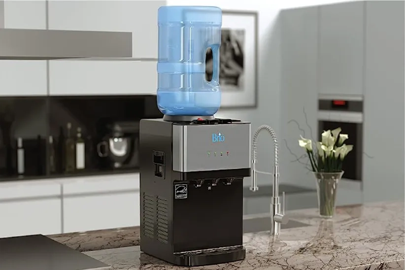 Brio Countertop Water Dispenser is in the kitchen and placed on the countertop.