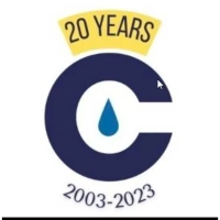 Commercial Water 20-year anniversary logo, serving Indianapolis with industrial water treatment.