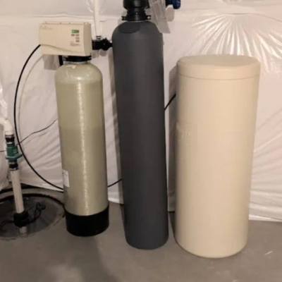 Culligan Denver home water treatment installation with a natural fiberglass mineral tank