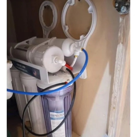 Custom Filtration installation of an under-sink Nu Aqua reverse osmosis water filter system