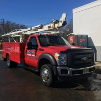 Red Ford service truck for D and L Pump Co., specializing in well pump and water system service.