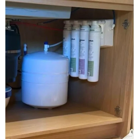 Under-sink multi-stage reverse osmosis water purification system installed by Dallas Water Doctor