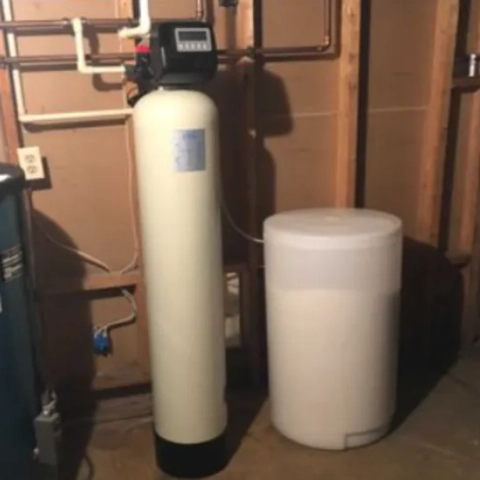 Donovan WaterWorks residential water softener system installed in a basement mechanical room