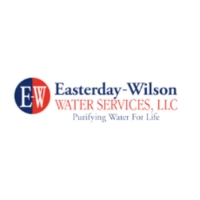 Easterday-Wilson Water Services LLC logo featuring a vertically split navy blue and red circular icon with white initials "EW" next to the stacked company name and tagline "Purifying Water For Life"
