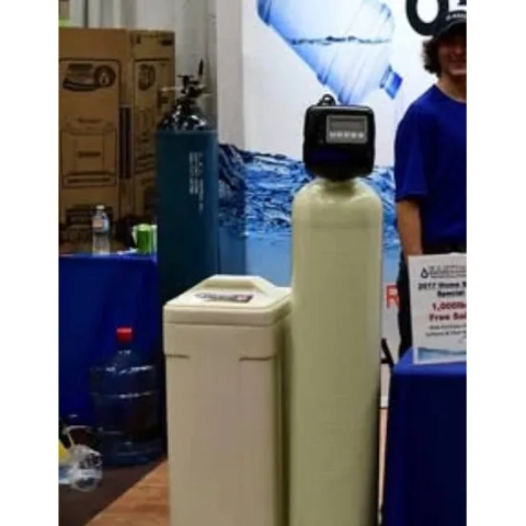 Easton Water Solutions high-efficiency water softener unit showcased at a home expo to treat hard water in Ohio