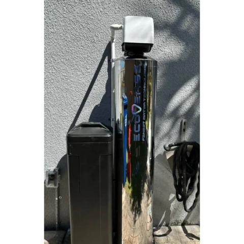 Ecoverse multi-stage water treatment system with a sleek stainless steel cover and space-saving vertical design