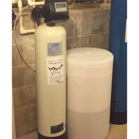 Professional point-of-entry domestic water softening setup equipped with an automated top-mounted control head module, expertly installed by Ensor Plumbing