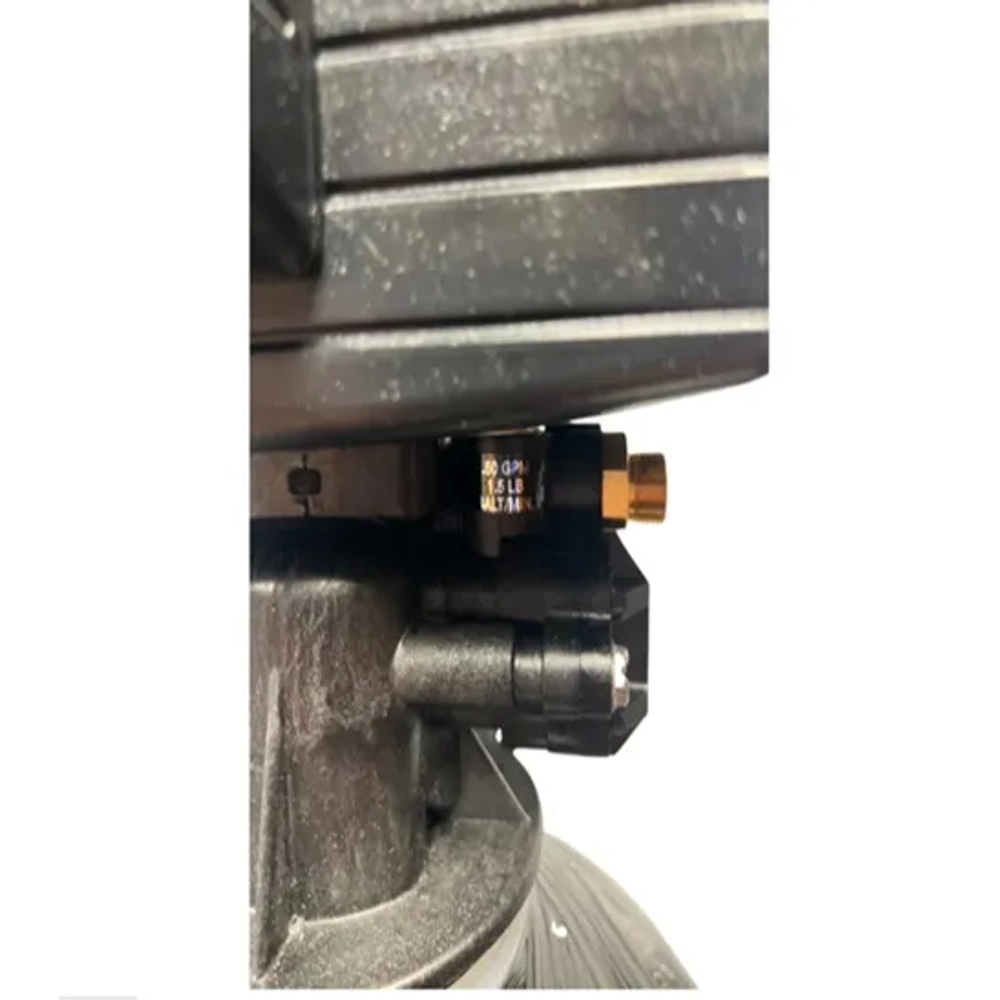 Close-up of Fleck 5600SXT valve connection showing flow specifications and brass fitting.