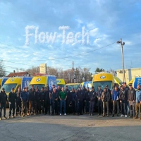 Flow-Tech water conditioning and John S Park plumbing service team by company fleet vans.