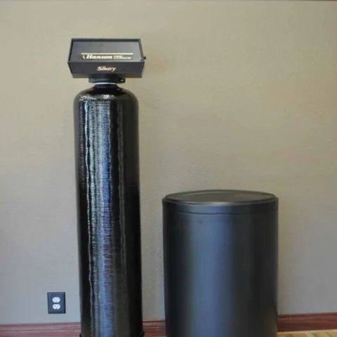 Hanson Sentry water conditioner system with black media tank and brine tank for hard water softening.