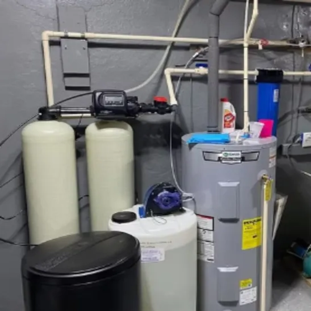 Complete utility room water purification layout showcasing filtration loops and storage vessels from Integrity Water Solutions