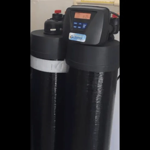 Integrity Water Treatment dual-tank water softener with black resin tanks and digital controller