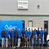 Karsare Systems home water systems team in front of building and Culligan service van.