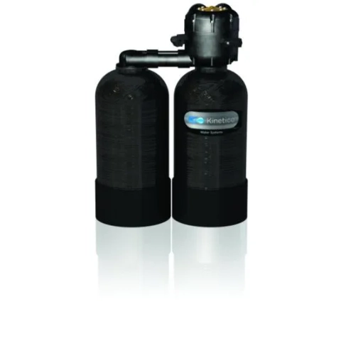 Kinetico 2040 residential water softener showing the dual black mineral tanks and valve.