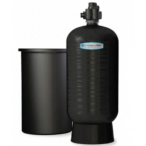 Kinetico HYDRUS commercial water softener system, showing the large black tank and brine tank.