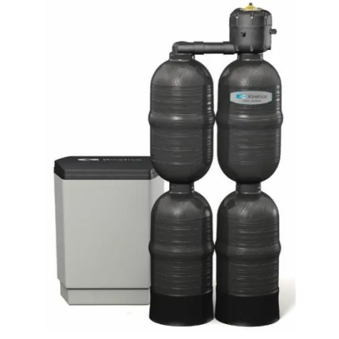 Quad-tank Kinetico Premier XP Q water softener and gray salt storage drum for large homes.