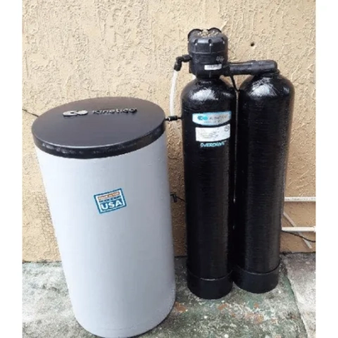 Kinetico Overdrive dual-tank water softener with a white brine tank and "Made in USA" certification