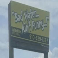 Lifetime Water Systems LLC billboard in Holly Ridge NC for water filtration and plumbing services