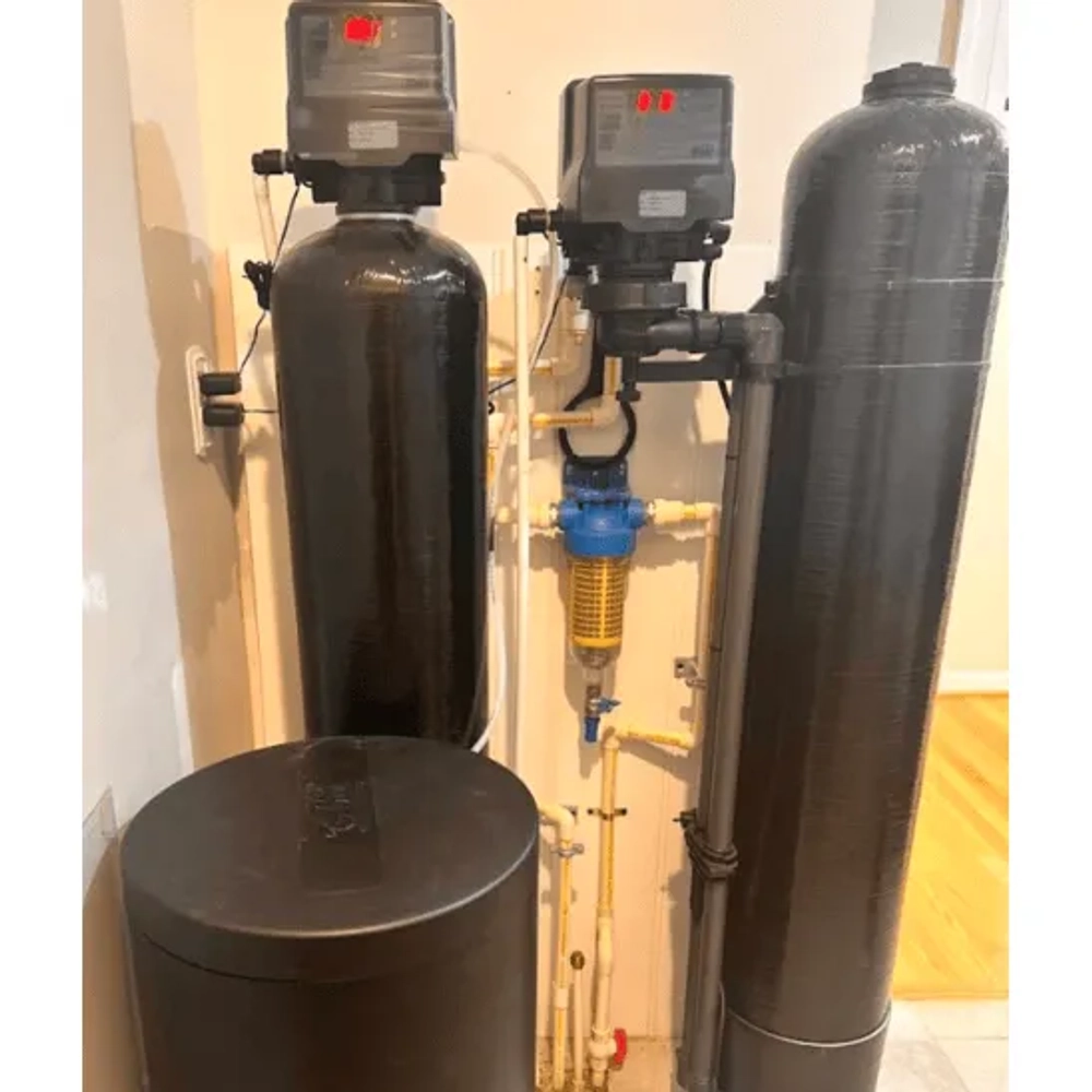 Lifewell Water Solutions dual-tank water treatment system paired with a pre-filter loop to eliminate orange stains