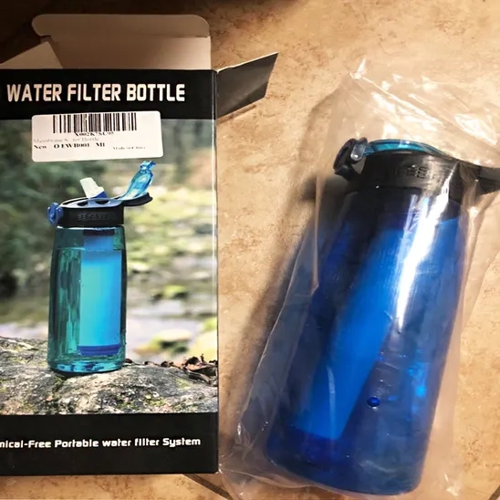 The box of the Membrane Solutions Water Filter Bottle shows it is functional for outdoor activities.