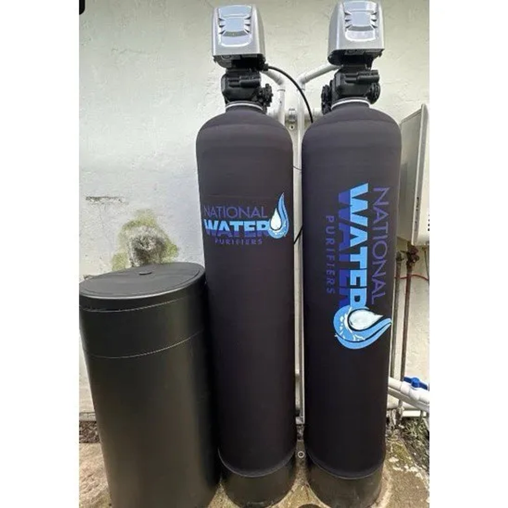 National Water Purifiers dual-tank system with grey media tanks, black brine tank, and UV sterilizer