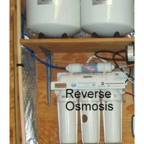 Compact under-counter point-of-use residential RO filtration manifold with high-capacity quick-change cartridge housings, installed by National Water Service