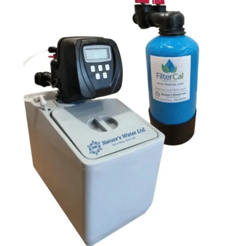 Professional domestic point-of-entry water conditioning cabinet tightly integrated into an indoor plumbing space to maximize household utility room efficiency, from Nature's Water Ltd