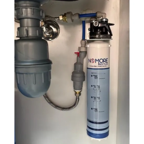 Compact direct-connect drinking water filtration system by No More Bottles UAE for domestic kitchen use
