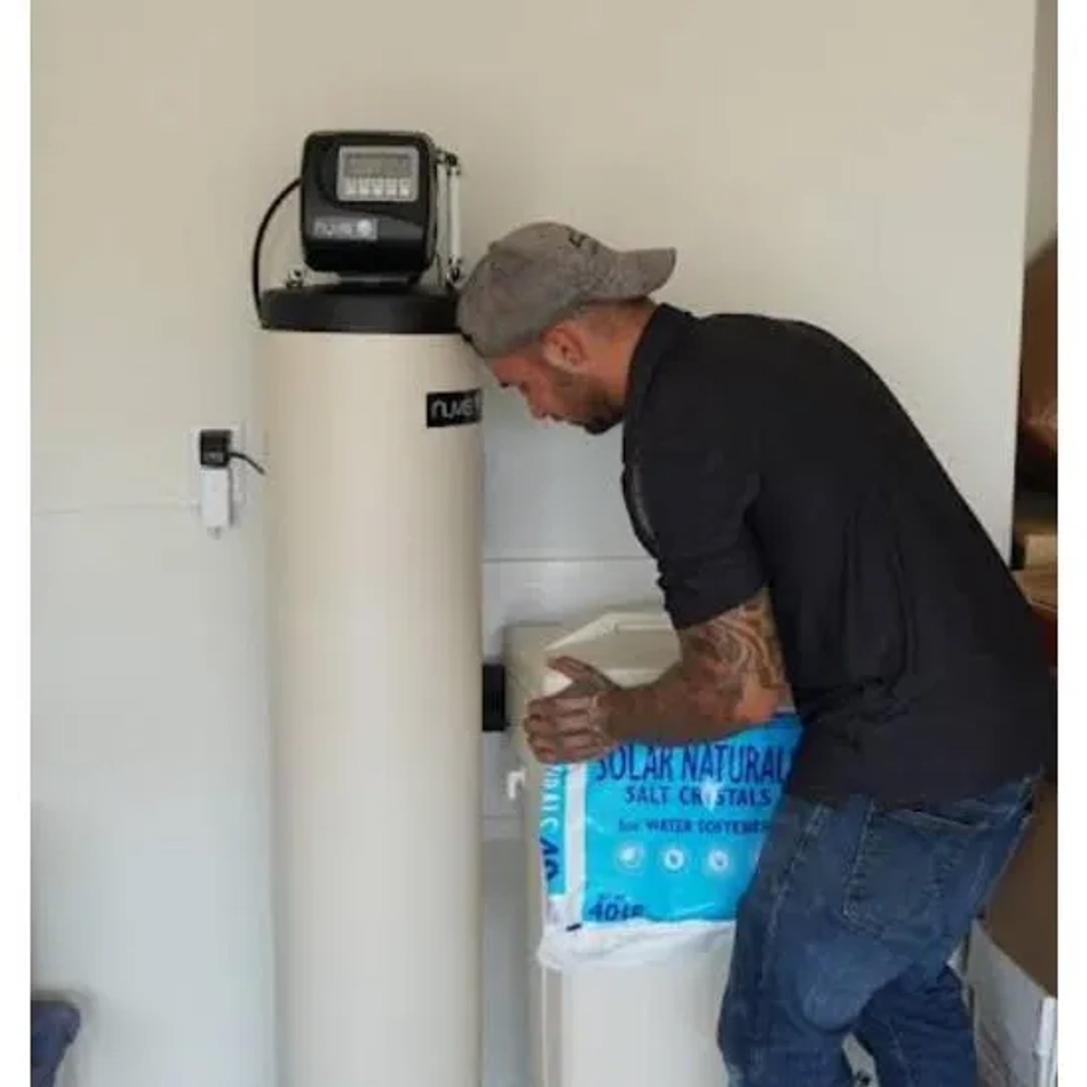 A professional water softener and filtration unit by ONIT Home installed for residential use.