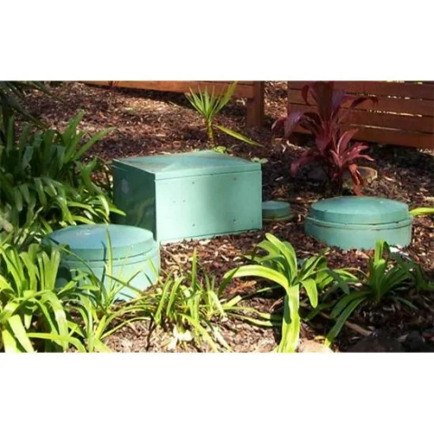 Central Coast Sewerage Services (Shoal Point, QLD) plumber installing a durable Ozzi Kleen polyethylene septic tank.