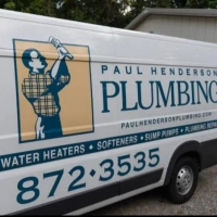 White commercial van wrap for Paul Henderson Plumbing with a plumber fixing a pipe graphic.