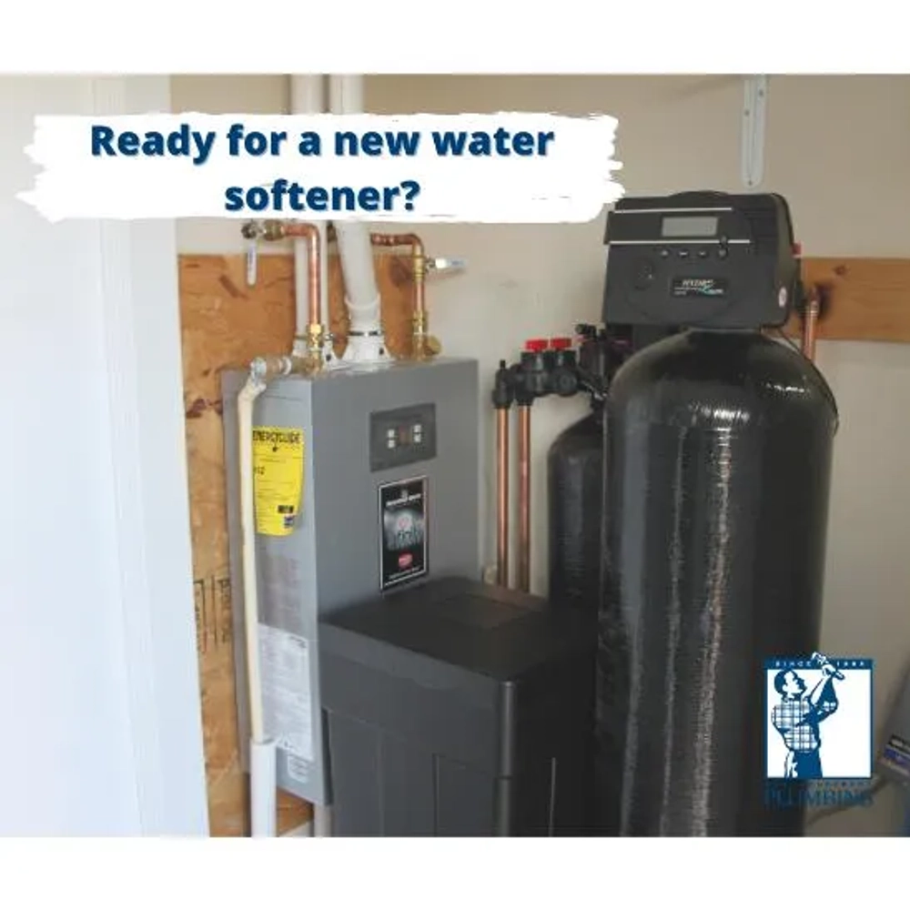 Complete home water system featuring a grey water heater and a black brine tank and media tank.