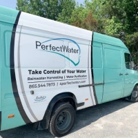 Teal and white PerfectWater service van showcasing rainwater harvesting and water purification services.