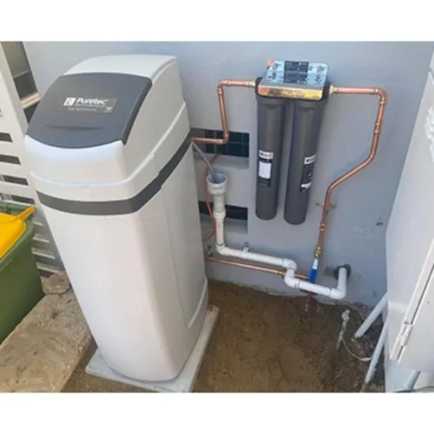 Water softeners eliminate dissolved minerals (Ca, Mg, Fe) that cause hard water scale, protecting appliances