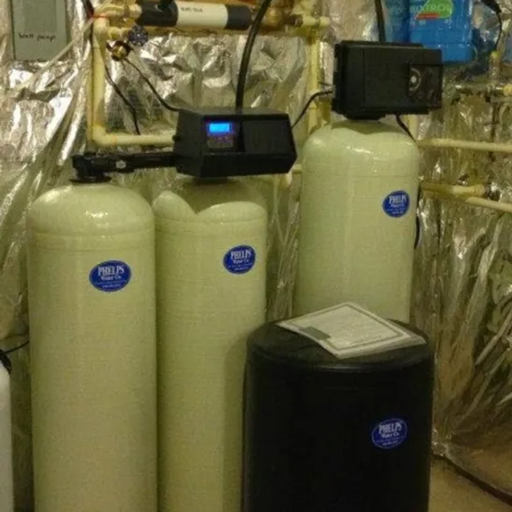 Advanced demand-metered electronic valve on a premium home water softening system configured by Phelps Water Company
