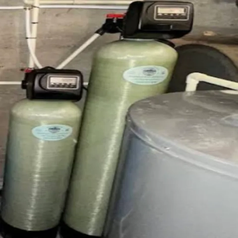 Residential ion-exchange water softener system configured with a demand-initiated digital display valve by Piedmont Well Service LLC