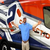 Plumbing Connection expert in Gastonia standing by a service van offering full plumbing repairs.