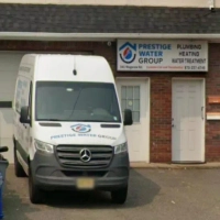 Commercial van and sign for Prestige Water Group, providing expert plumbing, heating, and water solutions.