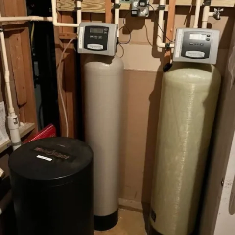 Smart demand-metered automated control heads mounted to upright filtration tanks from ProStream Plumbing