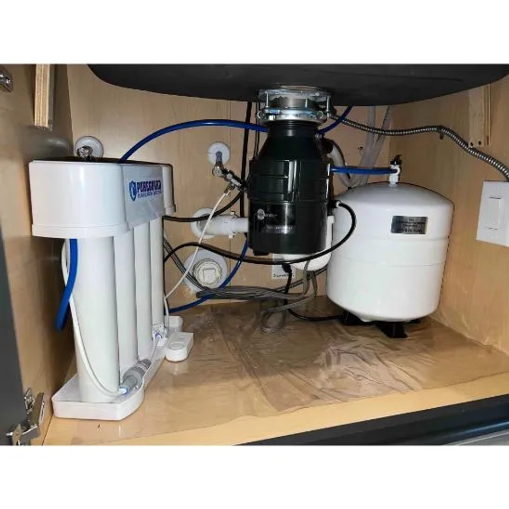 Professional installation of a Pureguard PGF-45 under-counter water filtration system for Houston homes.