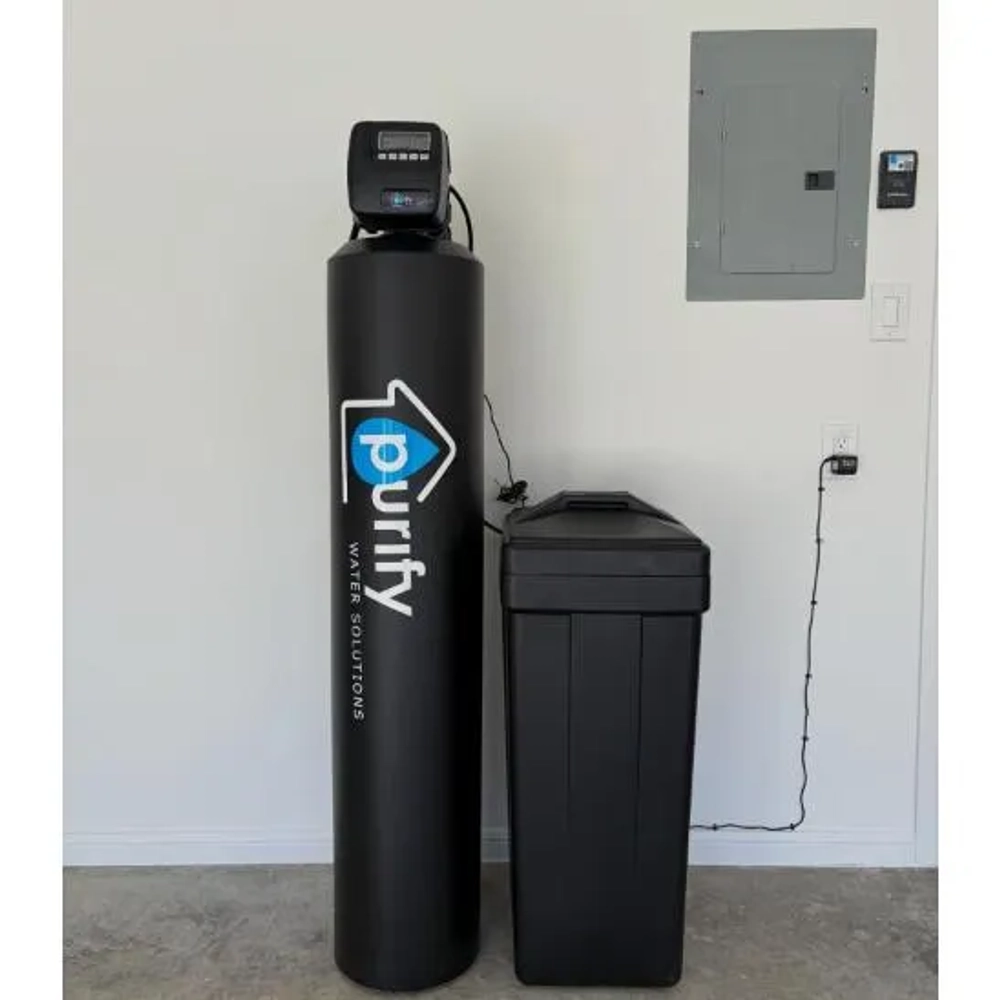 Purify Water Solutions home water softener system installed in a garage.