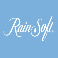 RainSoft logo featuring a flowing white script wordmark centered on a solid light blue background, with a stylized water droplet nested inside the letter "S"